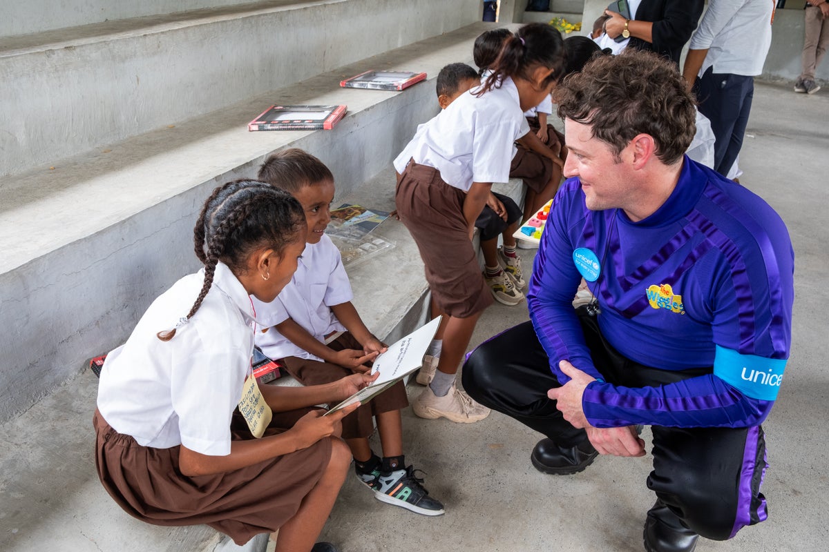 A man met with a group of Grade 6 students. 