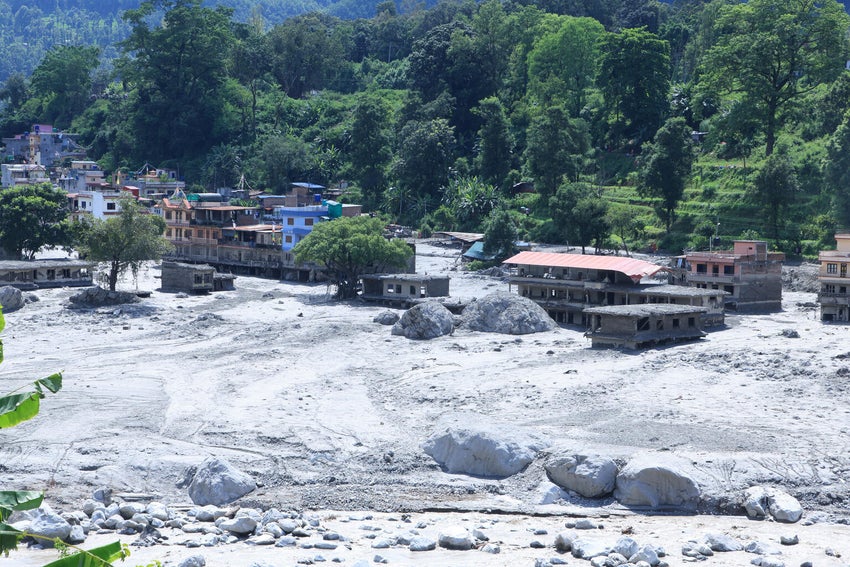 Views of settlements in Nuwakot District, Nepal, show homes and surrounding areas covered in mud after devastating flash floods swept through central northern Nepal.