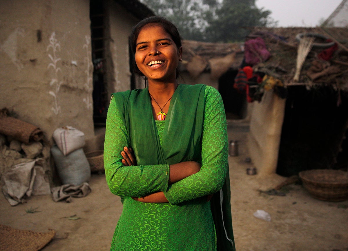 Girl in green dress and shawl laughing