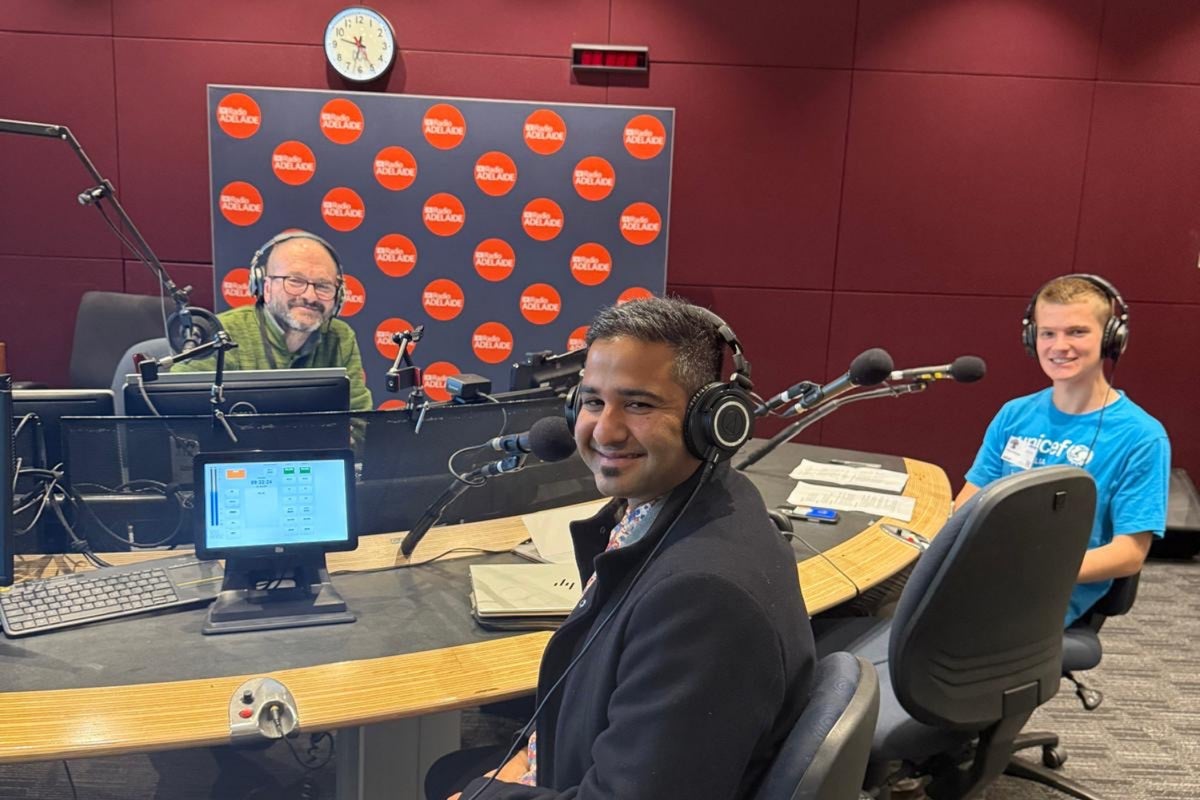 UNICEF Australia Young Ambassador Max and Head of Climate Nishadh Rego pose for a photo at the ABC Radio Adelaide studio.
