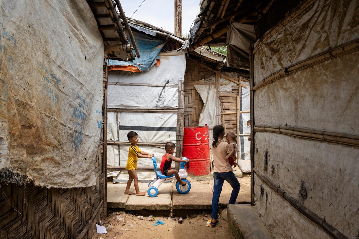 Children walking through the streets between shelters in the Rohingya refugee camps in Cox’s Bazar, Bangladesh. 