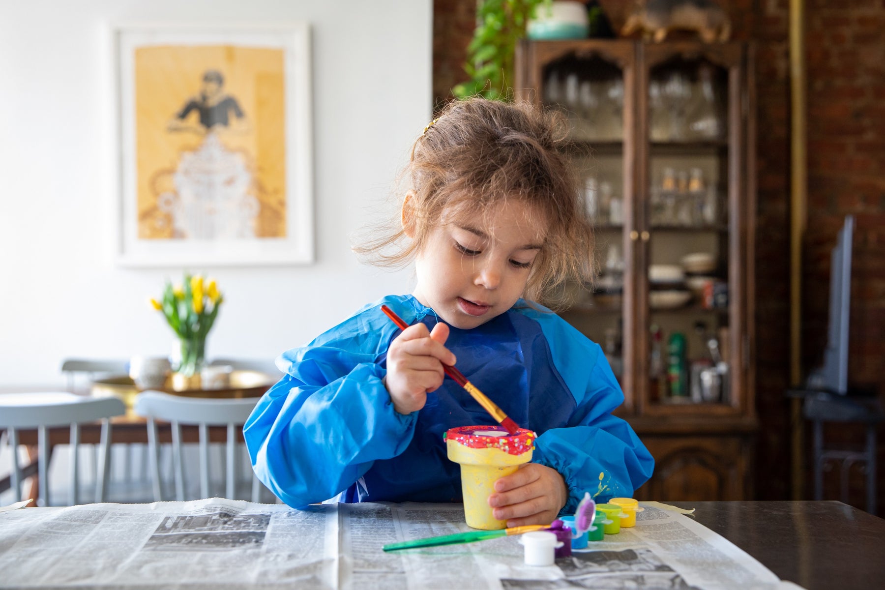 Child painting indoors