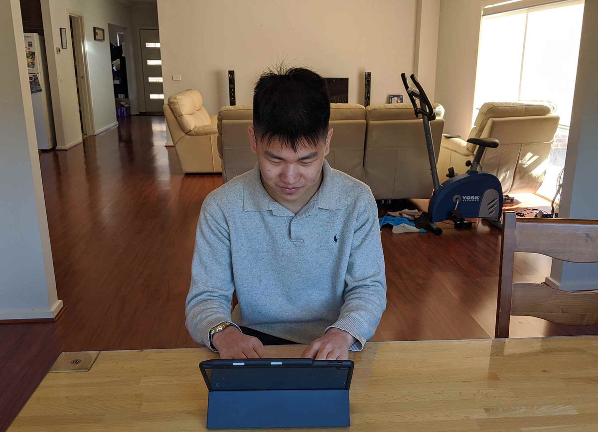 Brian sitting at table studying