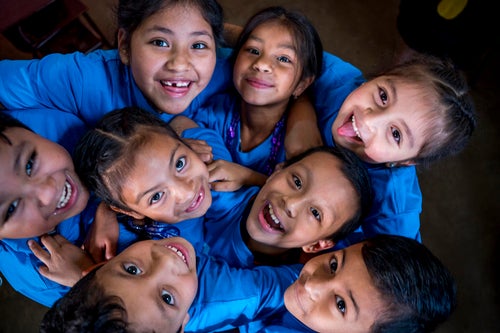 A group of school students looking up at the camera