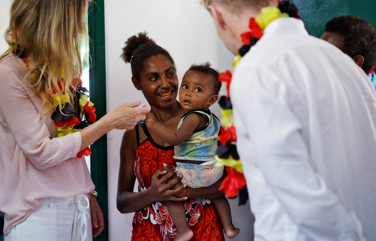 Ronan and Storm meet with mothers and babies during a visit to PNG.