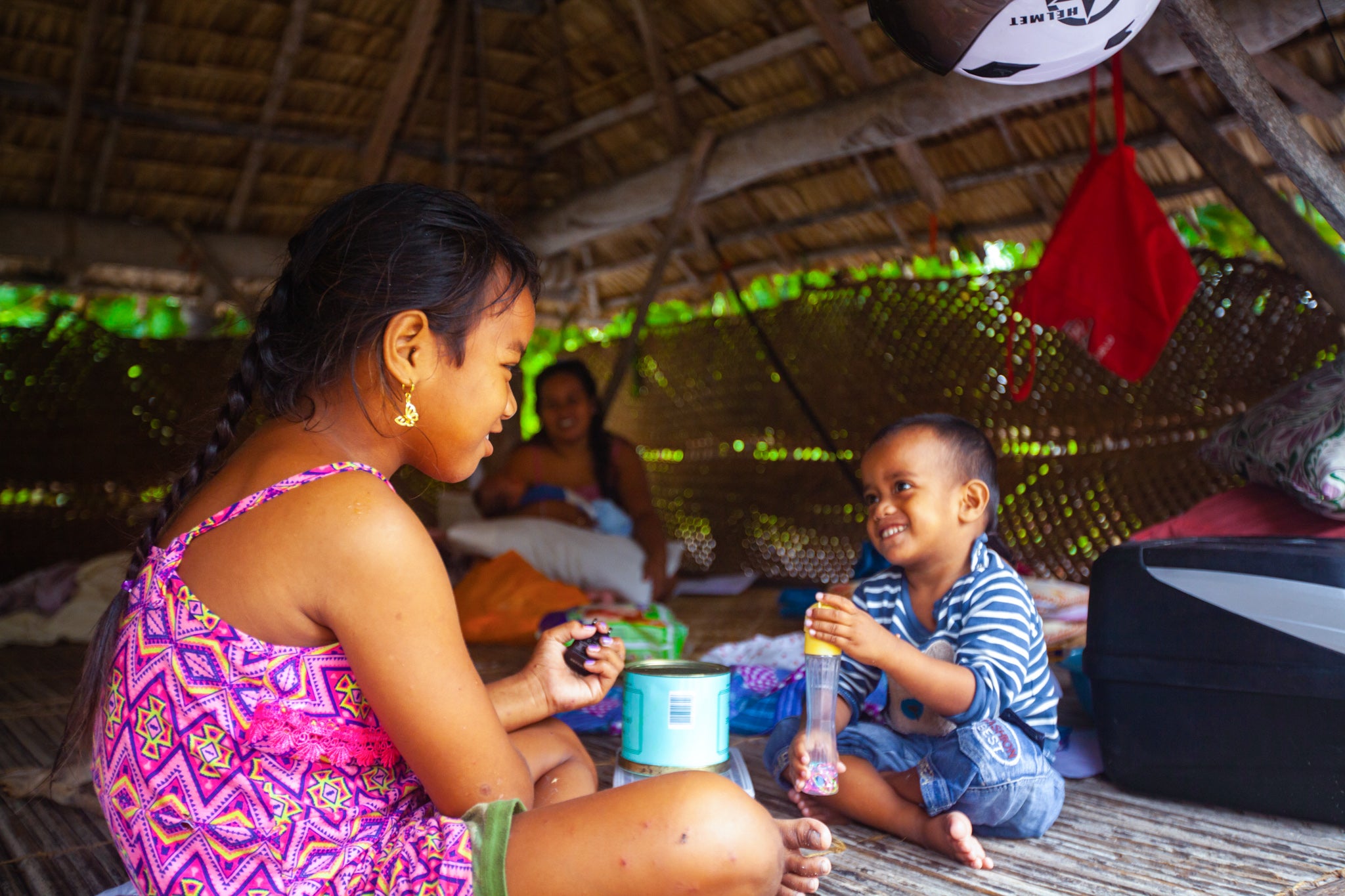 two children playing in an open air home