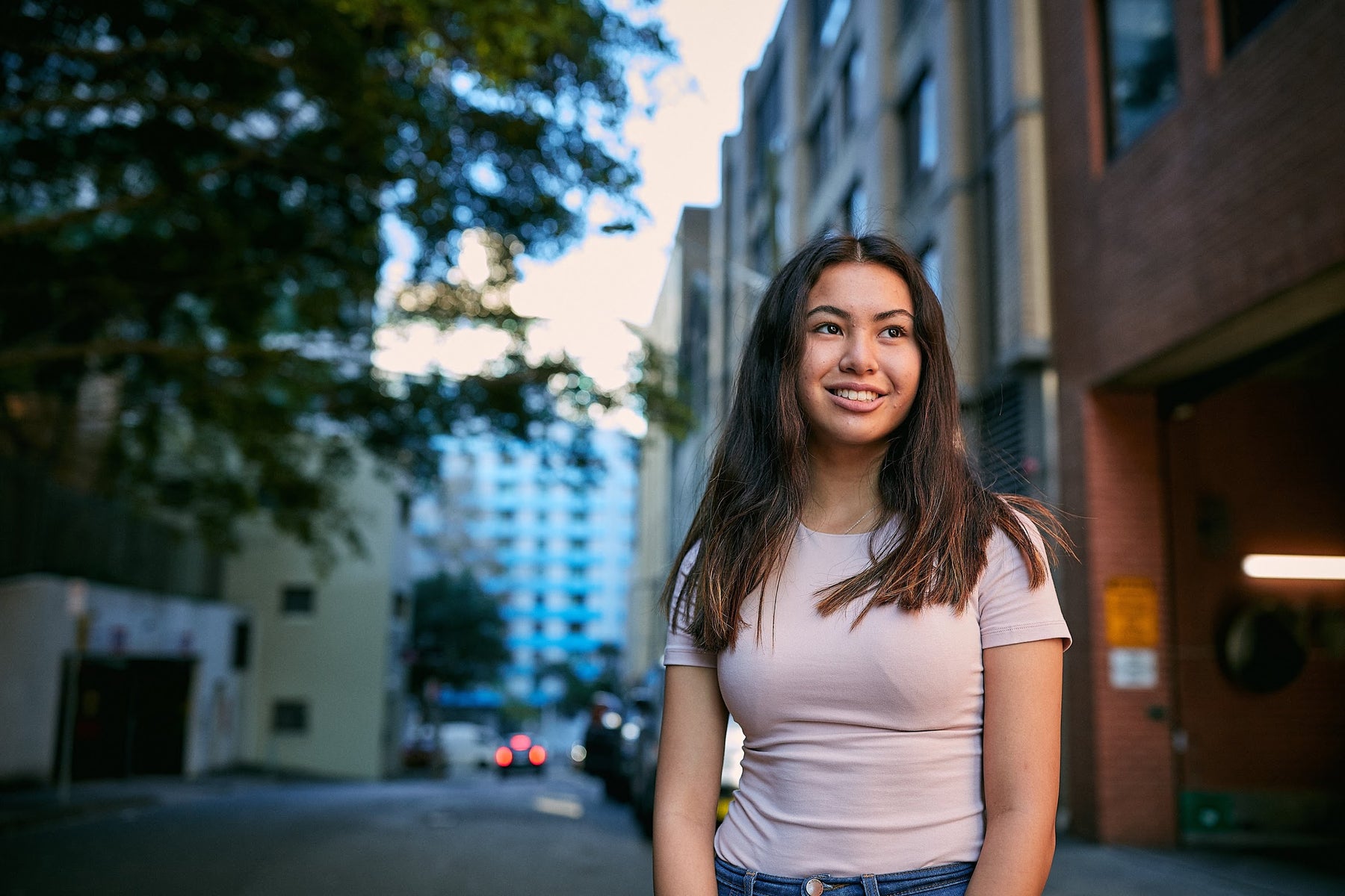 Daphne stands in street