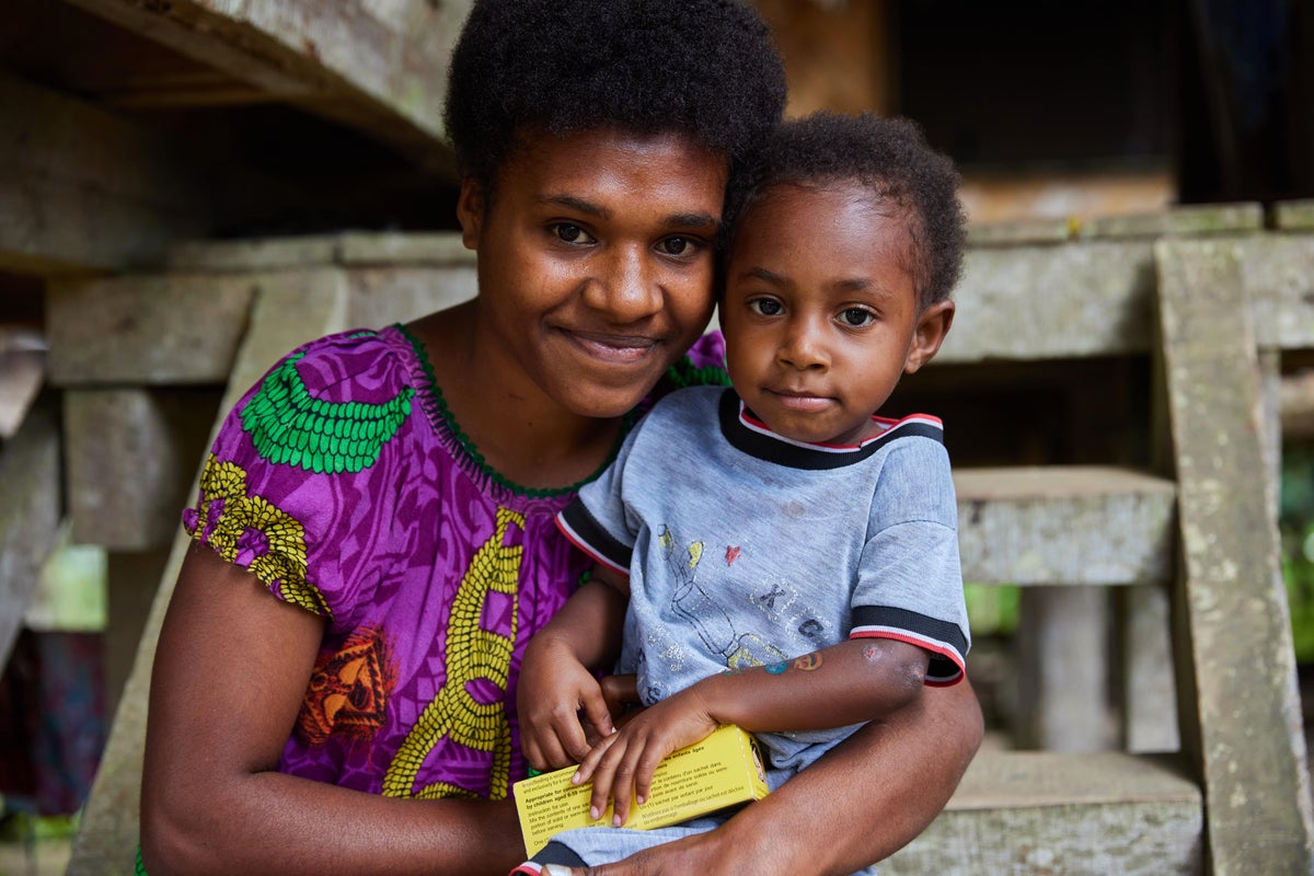 In a remote village in Papua New Guinea, a UNICEF-supported Village Health Assistant screened Terah's two-year-old daughter, Faith, for malnutrition. 