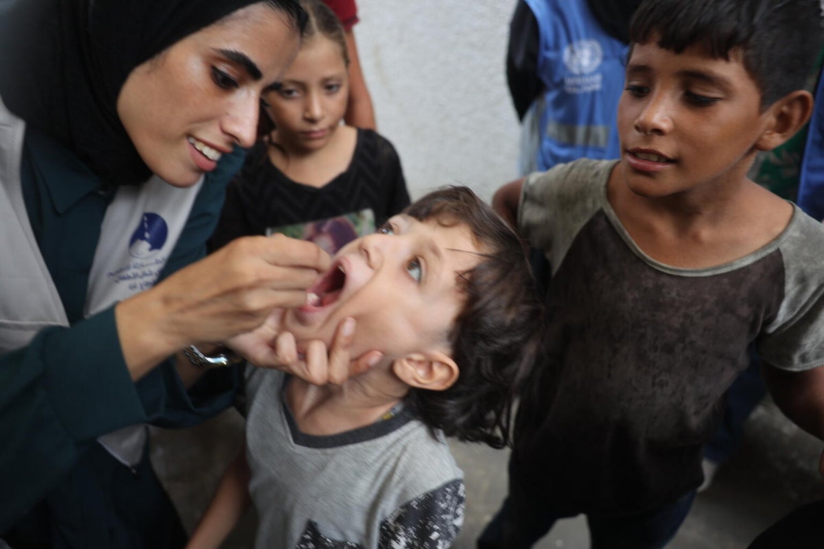 Children receive polio vaccines at UNRWA health clinic in the centre of the Gaza Strip.  