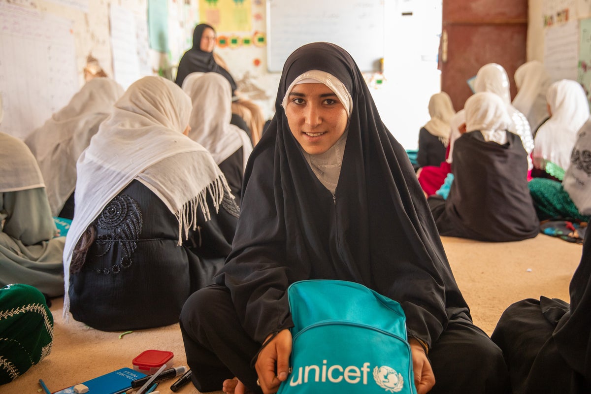 A 16-year-old girl sits in a classroom in Afghanistan