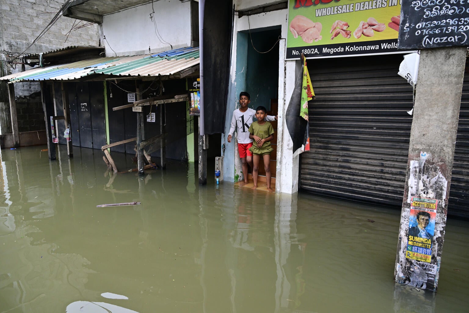 Two children impacted by the floods in Sri Lanka