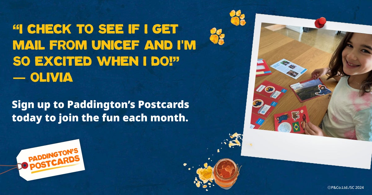 A young girl shows off her Paddington's Postcards pack. Text reads: "I check to see if I get mail from UNICEF and I'm so excited when I do!" - Olivia
