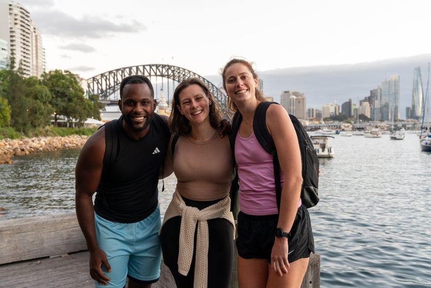 People walking along Sydney Harbour