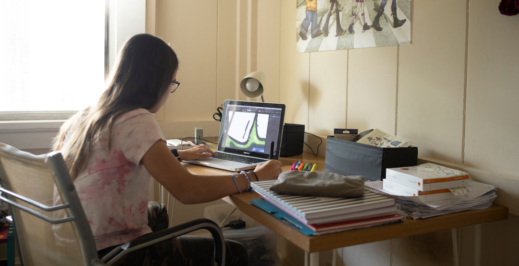 Child sits at her computer
