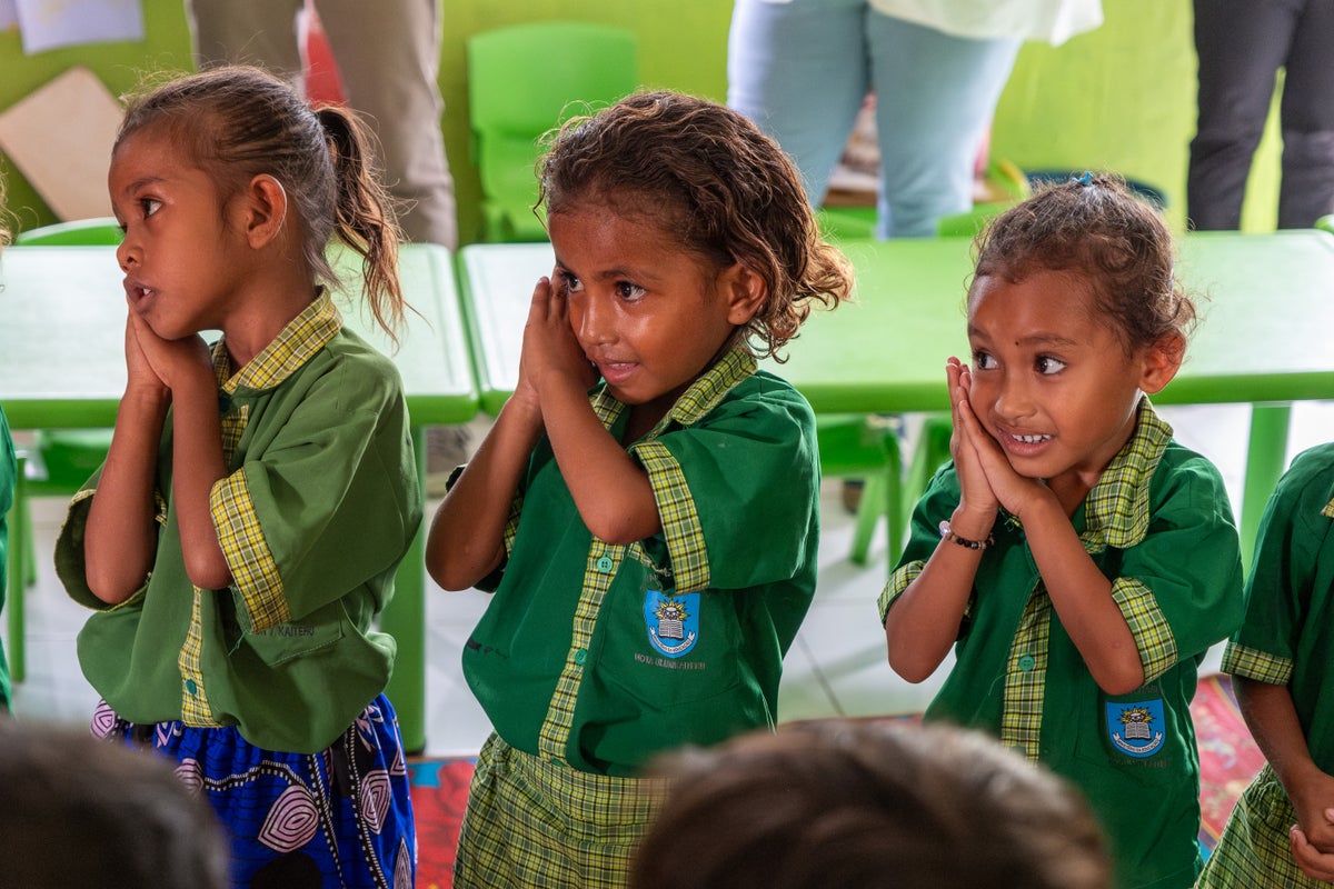 Young students singing along to a song