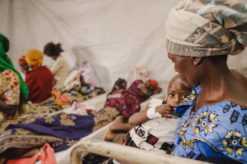 A mother holds her child who is suffering from mpox at the isolation unit of the UNICEF-supported hospital in Democratic Republic of the Congo.