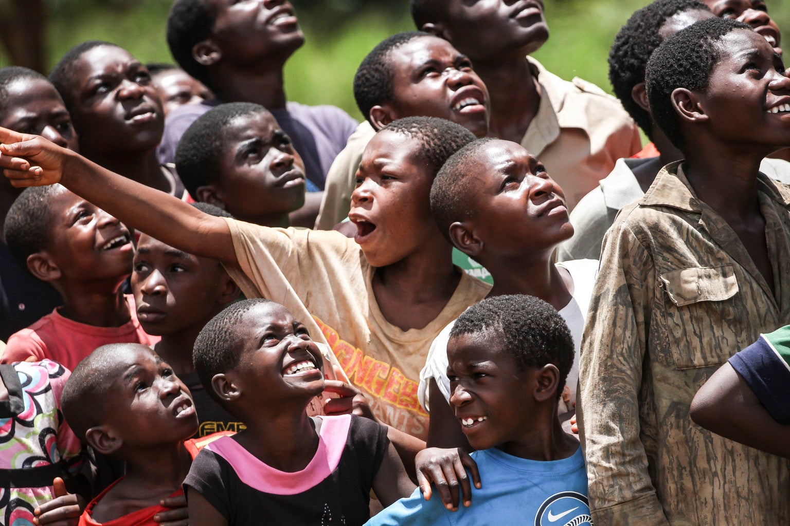 A group of boys look up to the sky