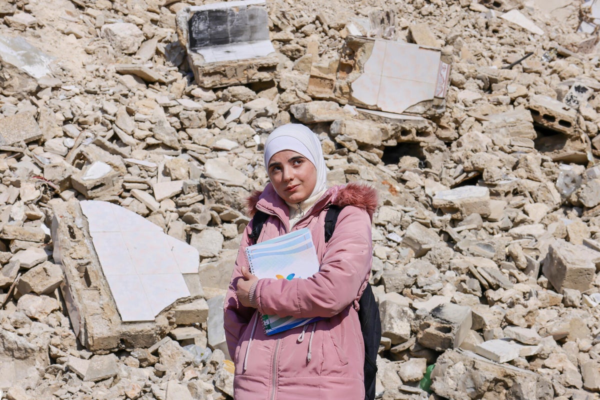 Cidra, 16, walks home from the UNICEF-supported Adolescent Development and Participation centre in Syria.