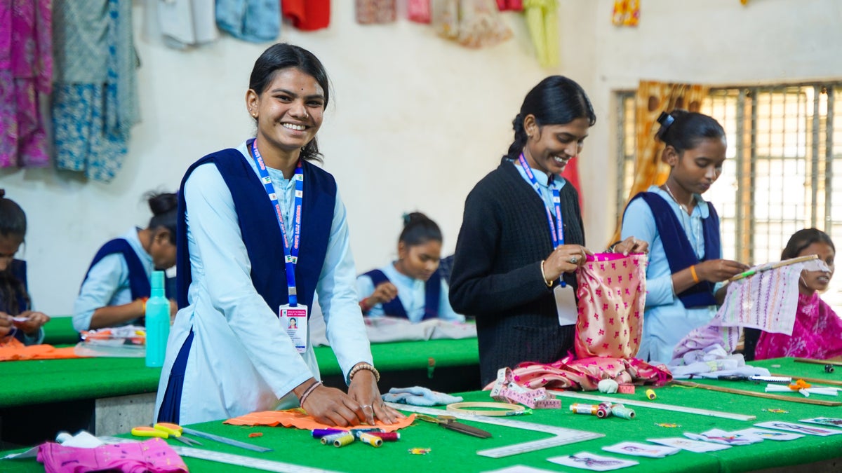 Teenage girls participate in a textiles training workshop in India. 