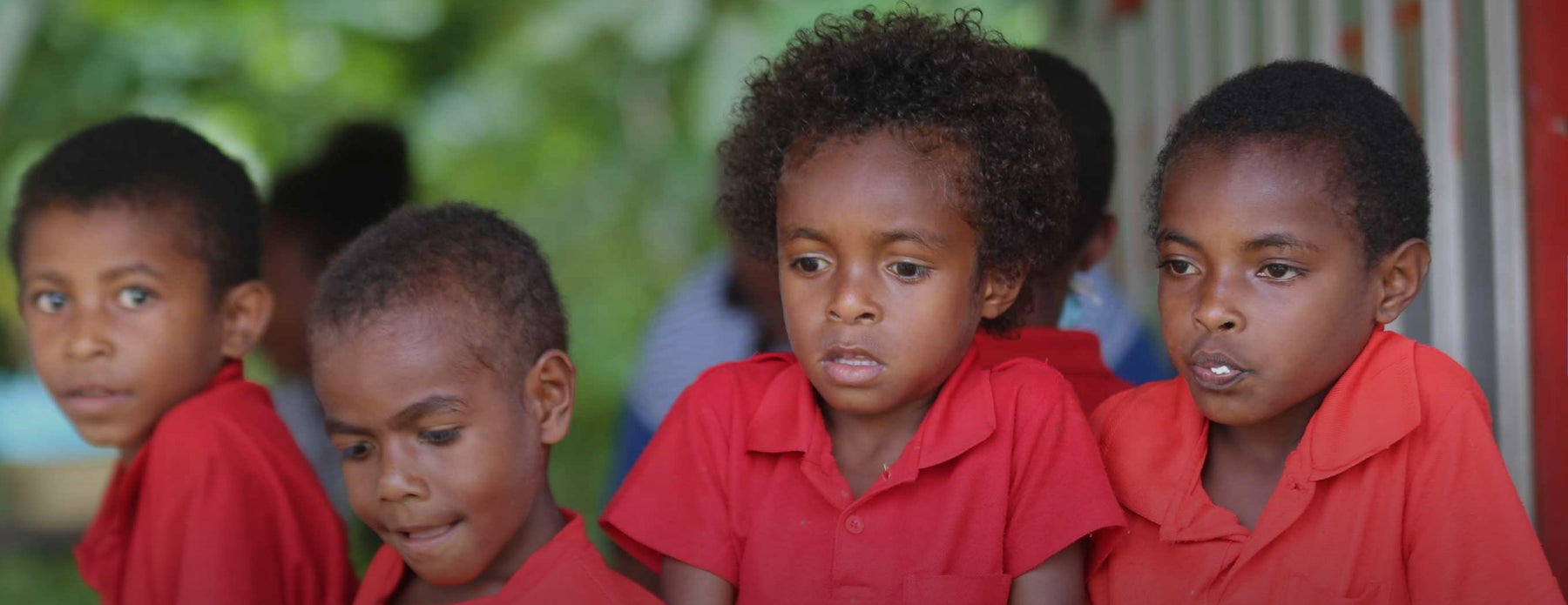 Young children outside their classroom.