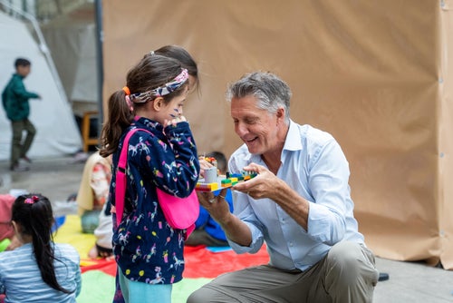 Man with two small children