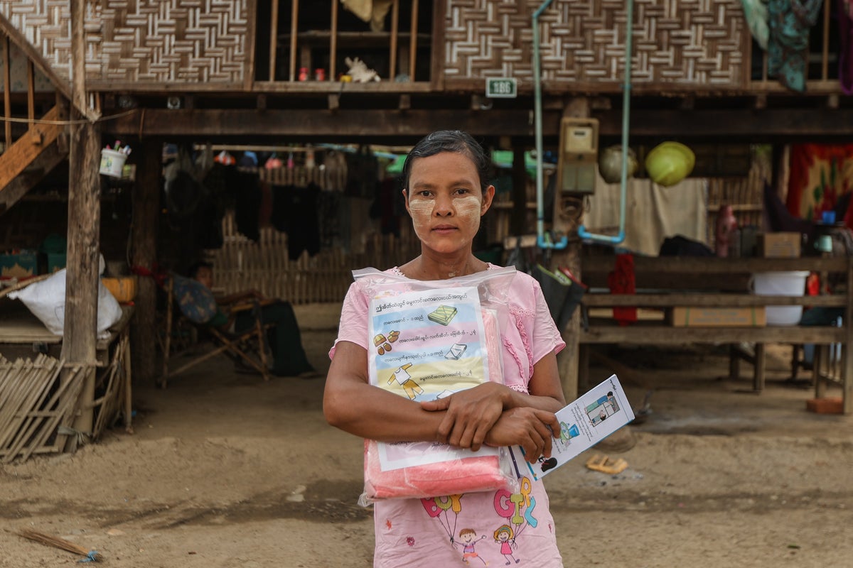 Ma Than Than, who is 39 years old and pregnant, holds a Newborn Kit provided by UNICEF for those affected by the earthquakes. 