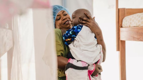 Woman holds baby 
