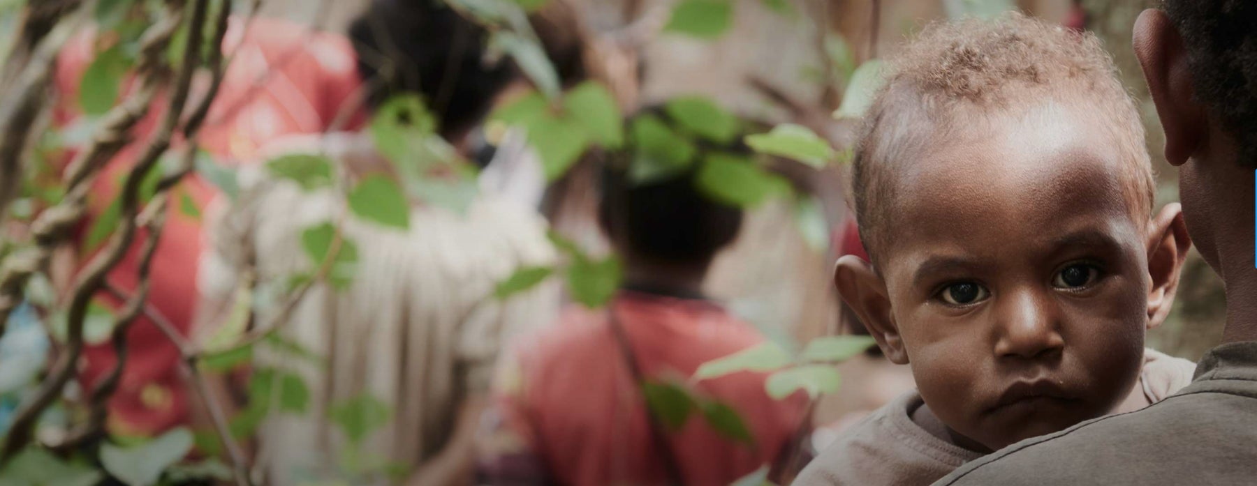 Child stares into camera