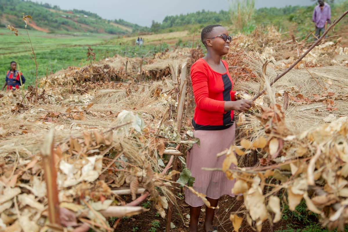 A woman standing in a field.