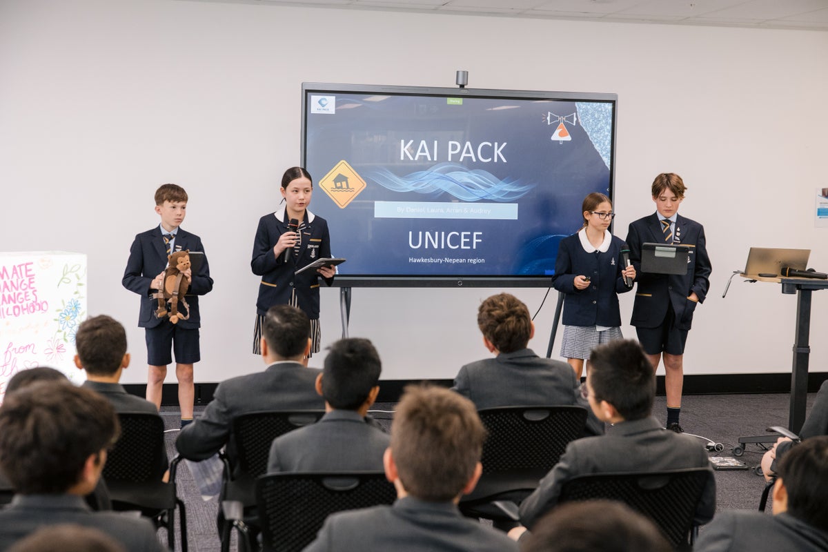 Students presenting their idea to the UNICEF Australia team.