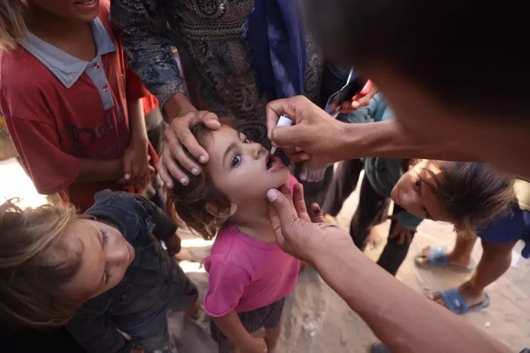 Children are receiving polio vaccines at health clinic at a health clinic in Khan Younis, southern Gaza Strip.