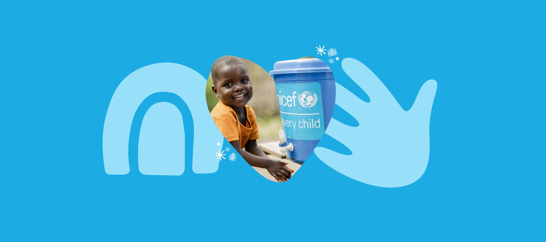 A young child washes her hands with clean water provided by UNICEF 