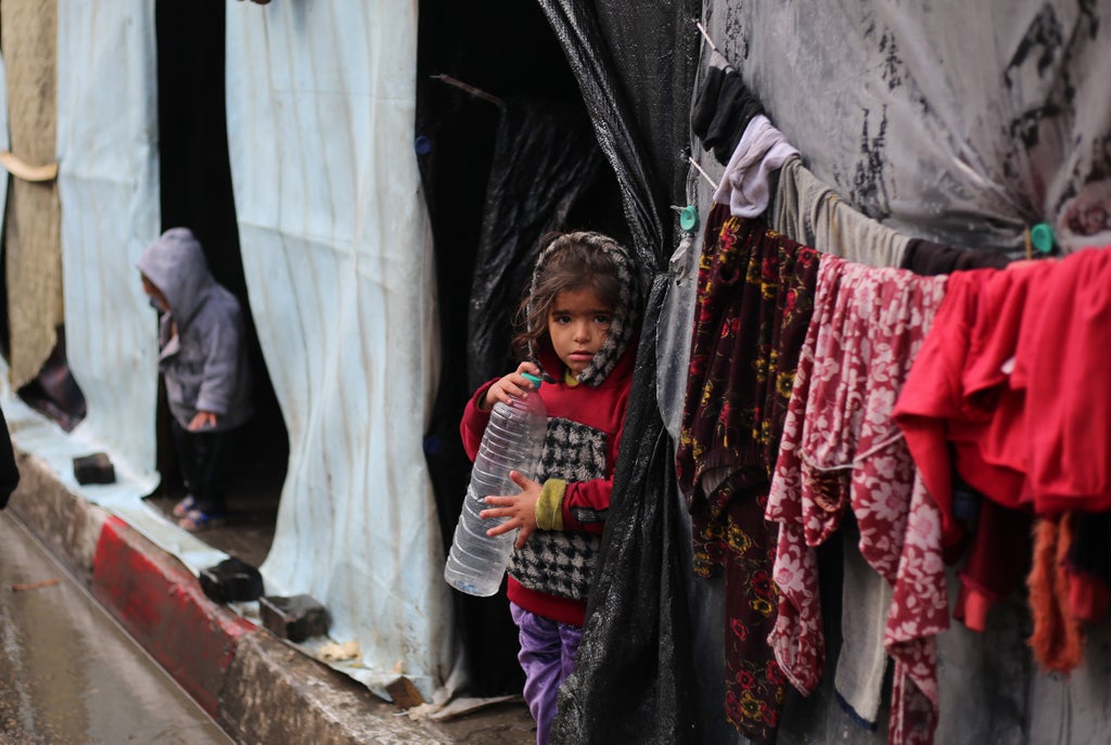Young girl in Gaza standing out the front of her temporary home.