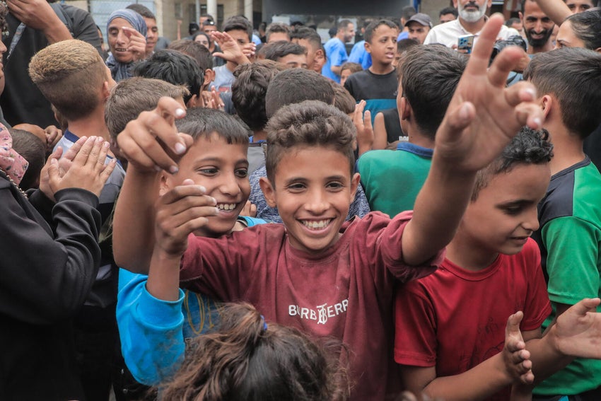 Children celebrate when the news of the ceasefire in Gaza was announced