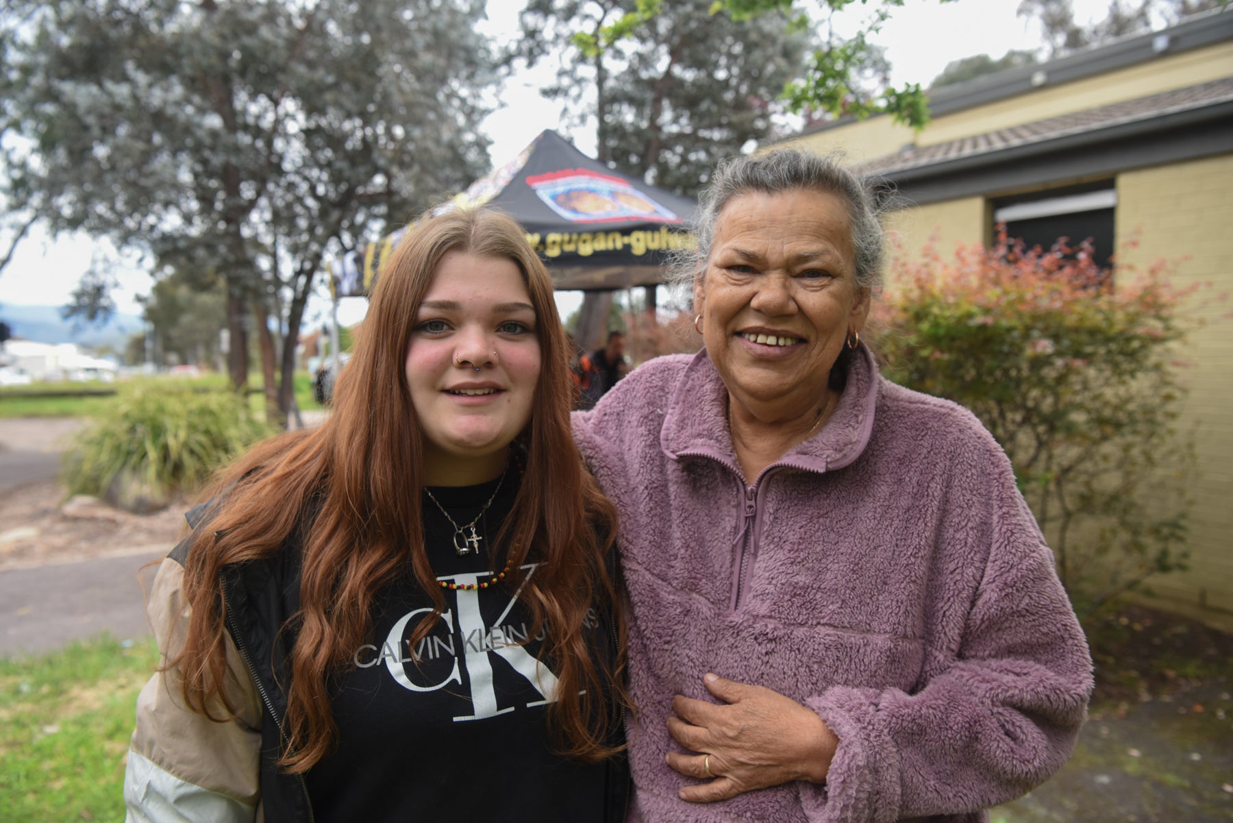 Mother and daughter smile for a photo