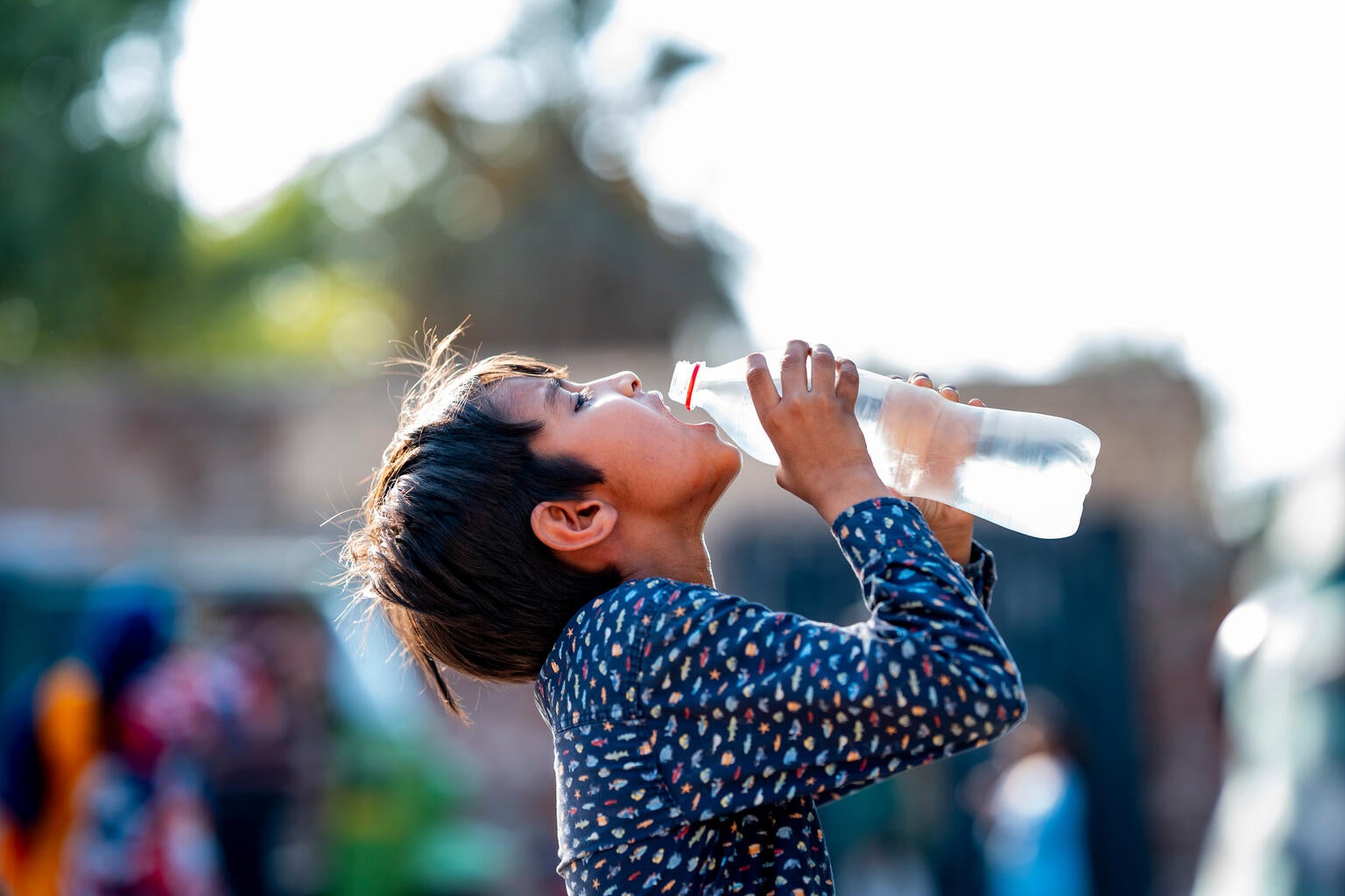 Ahmed takes a big gulp of cold water, trying to cool down in the 47°C heatwave in Pakistan.  