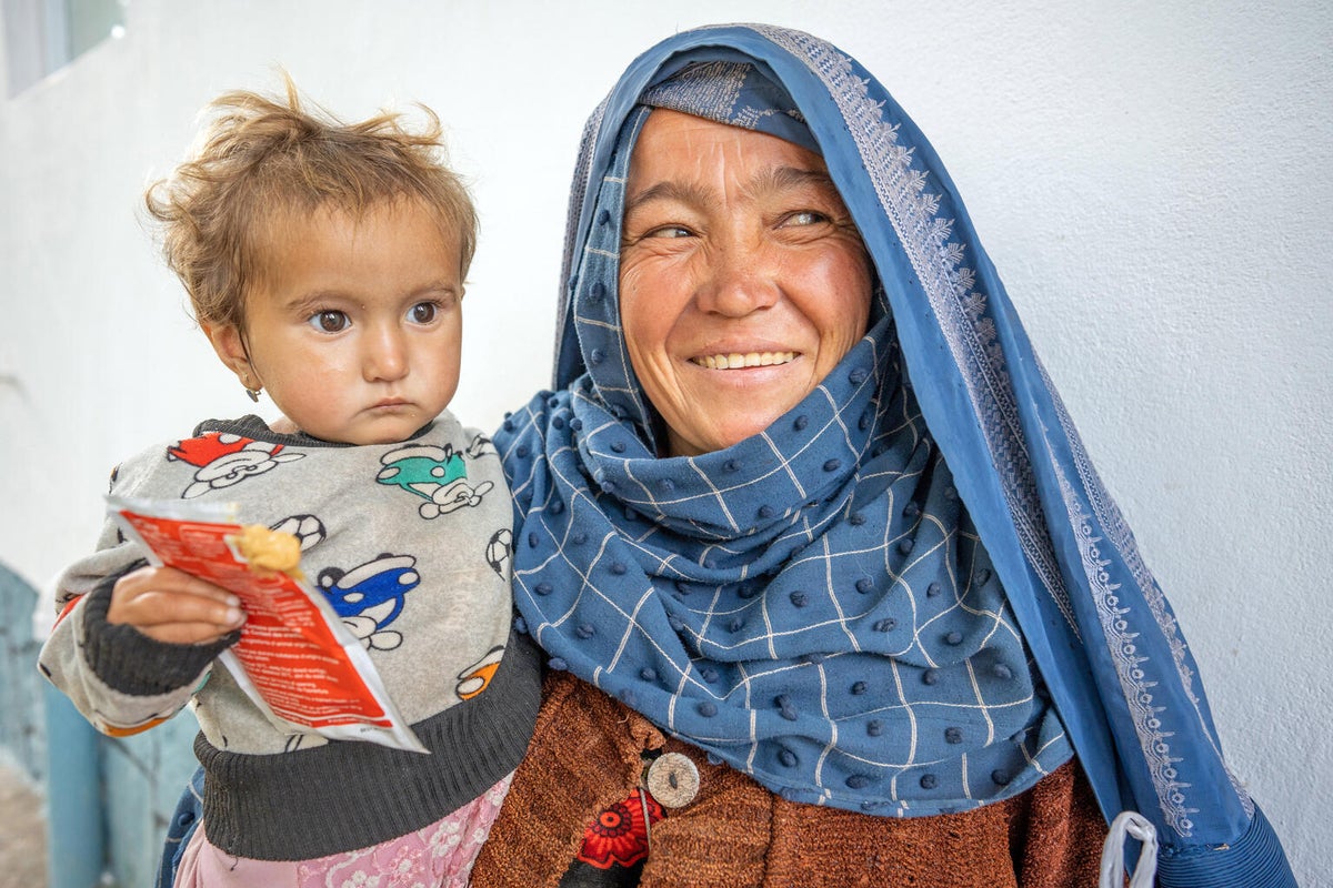 Two-year-old Noor eats ready-to-use therapeutic food (RUTF) to treat her severe acute malnutrition in Afghanistan. 