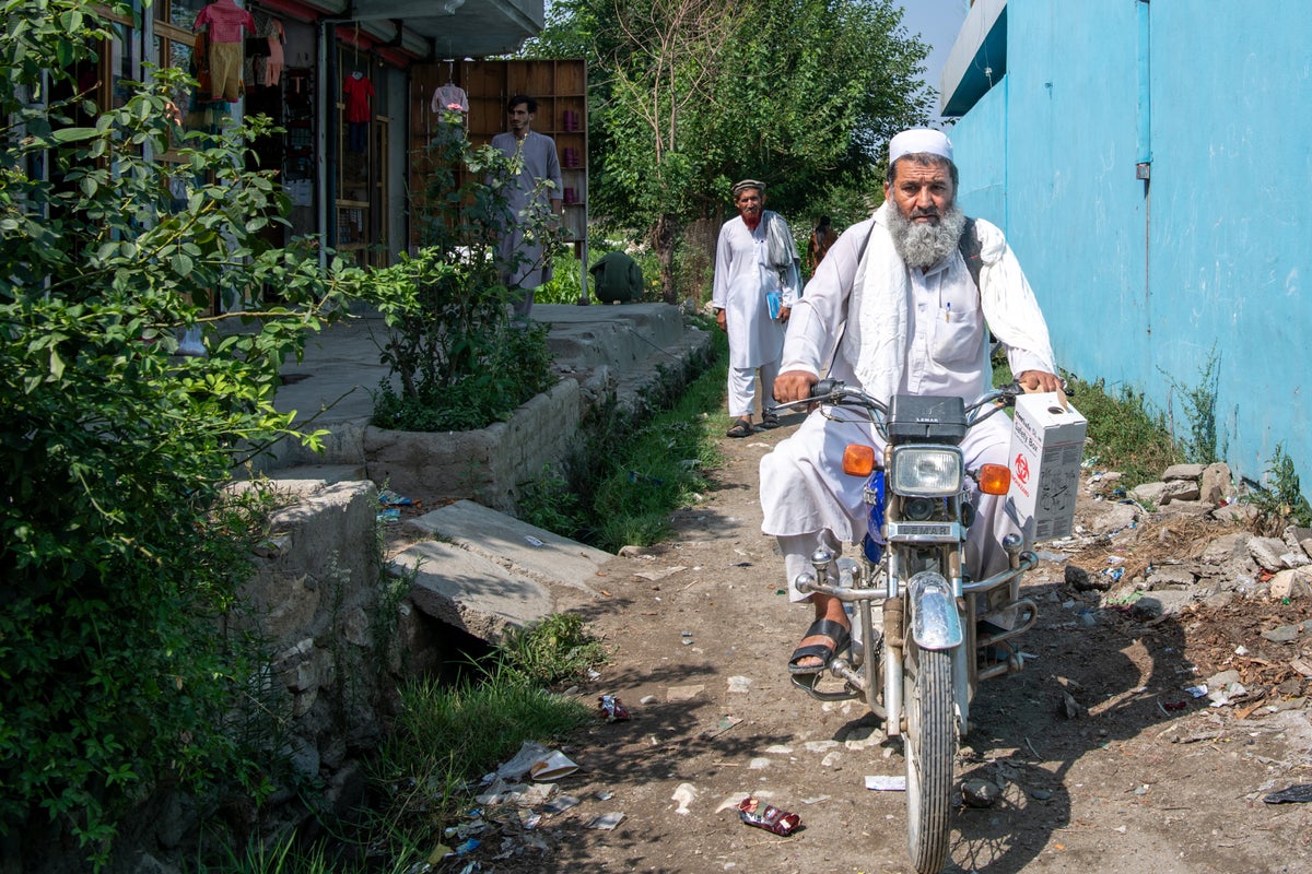 Man on motorbike out for delivery