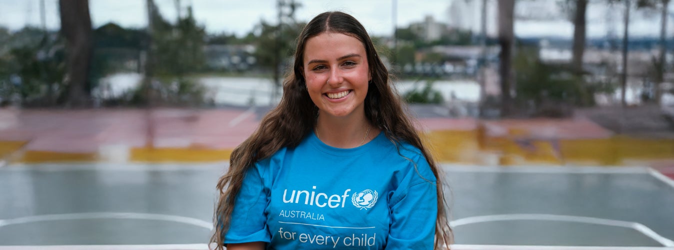 A UNICEF Australia Young Ambassador in a blue t-shirt. 