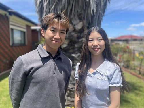 Two students looking to camera