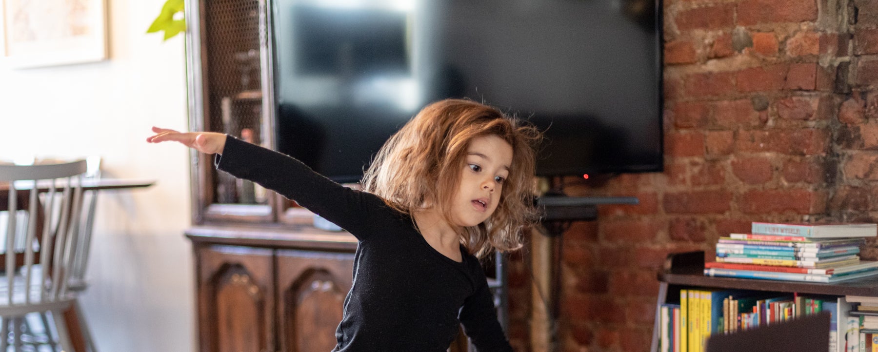 Young girl plays indoors