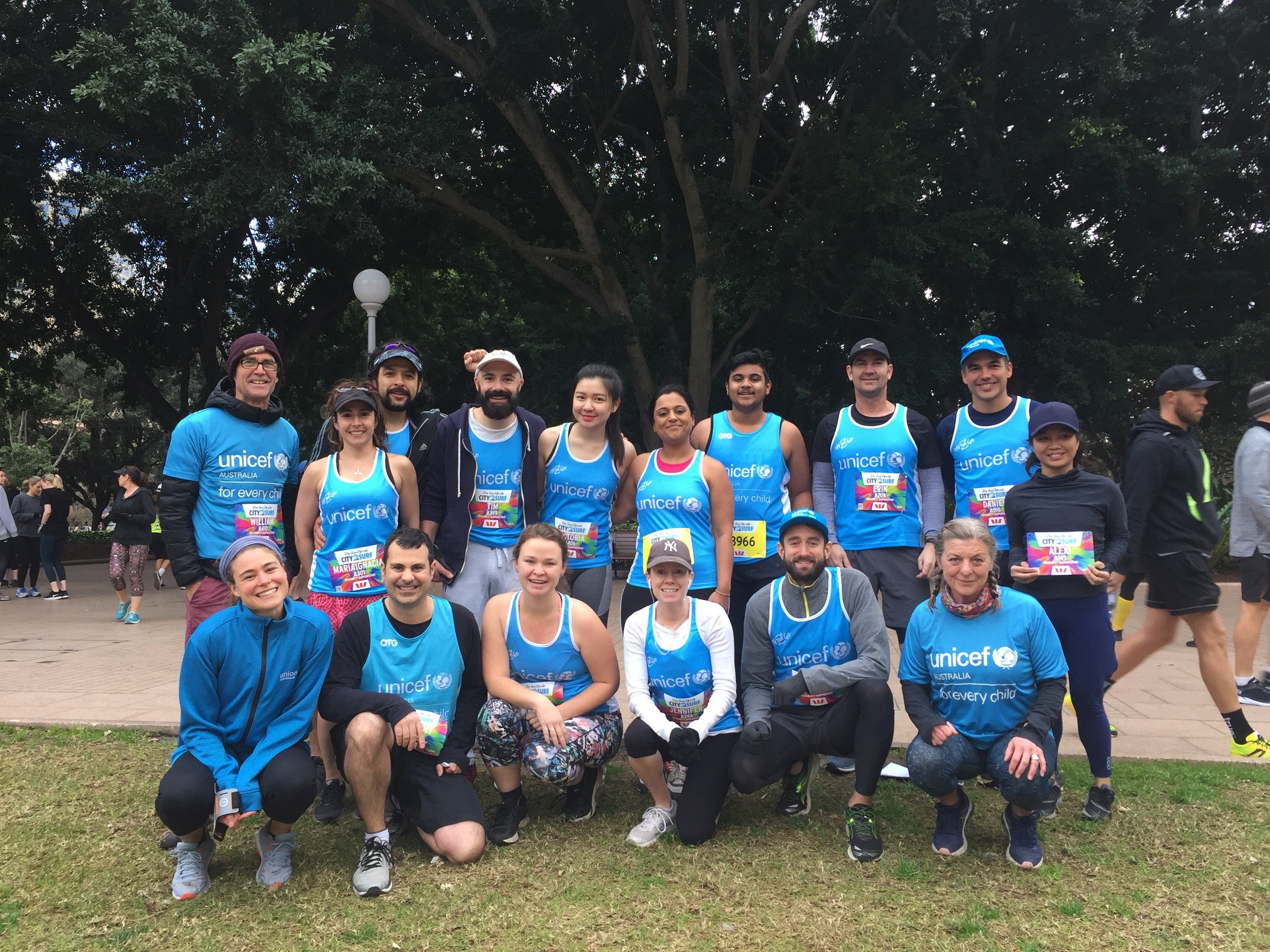 A group of people wearing UNICEF singlets.