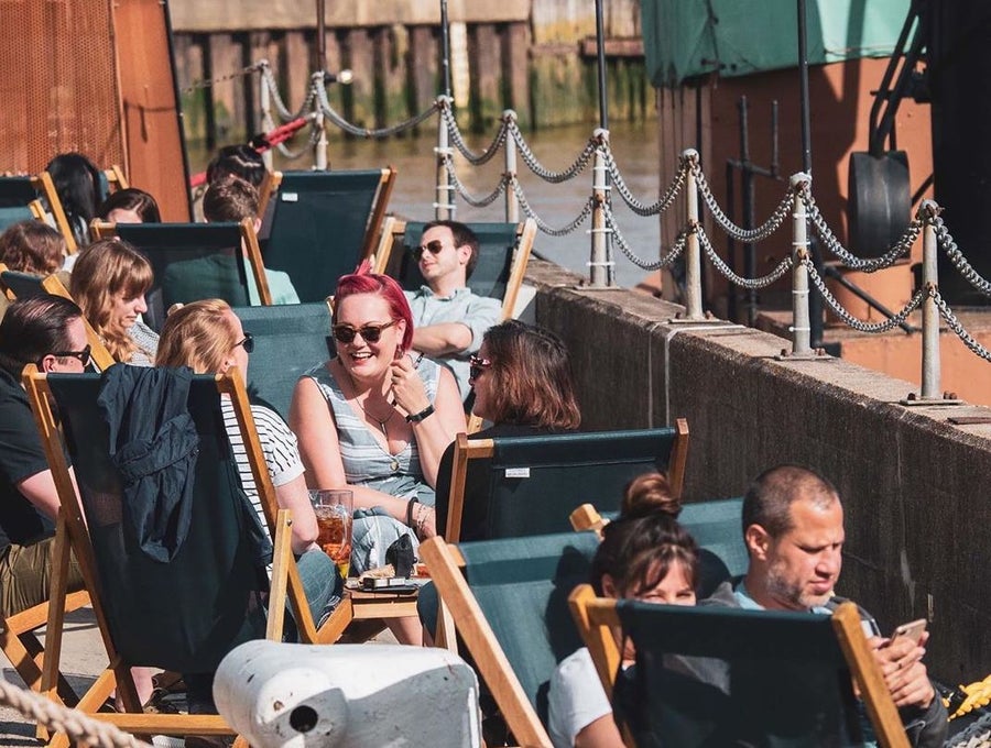 Trinity Buoy Wharf, deckchairs in Summer.