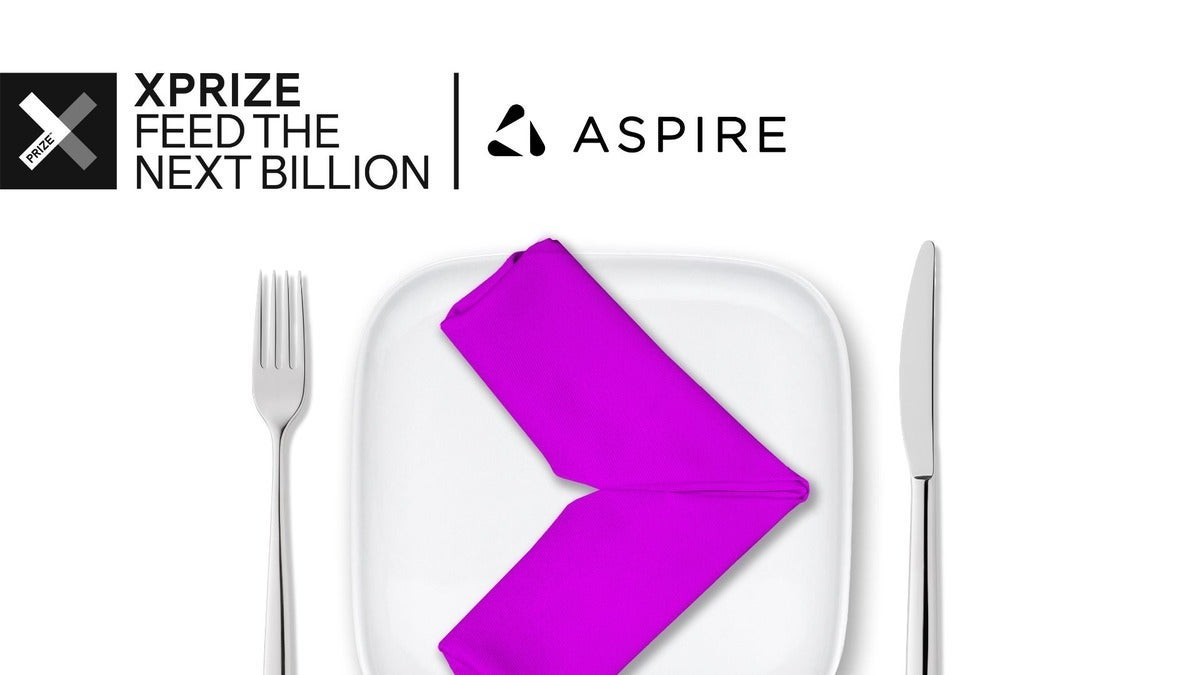 A fuschia napkin folded like a chevron, on a square plate with a fork and knife on either side.