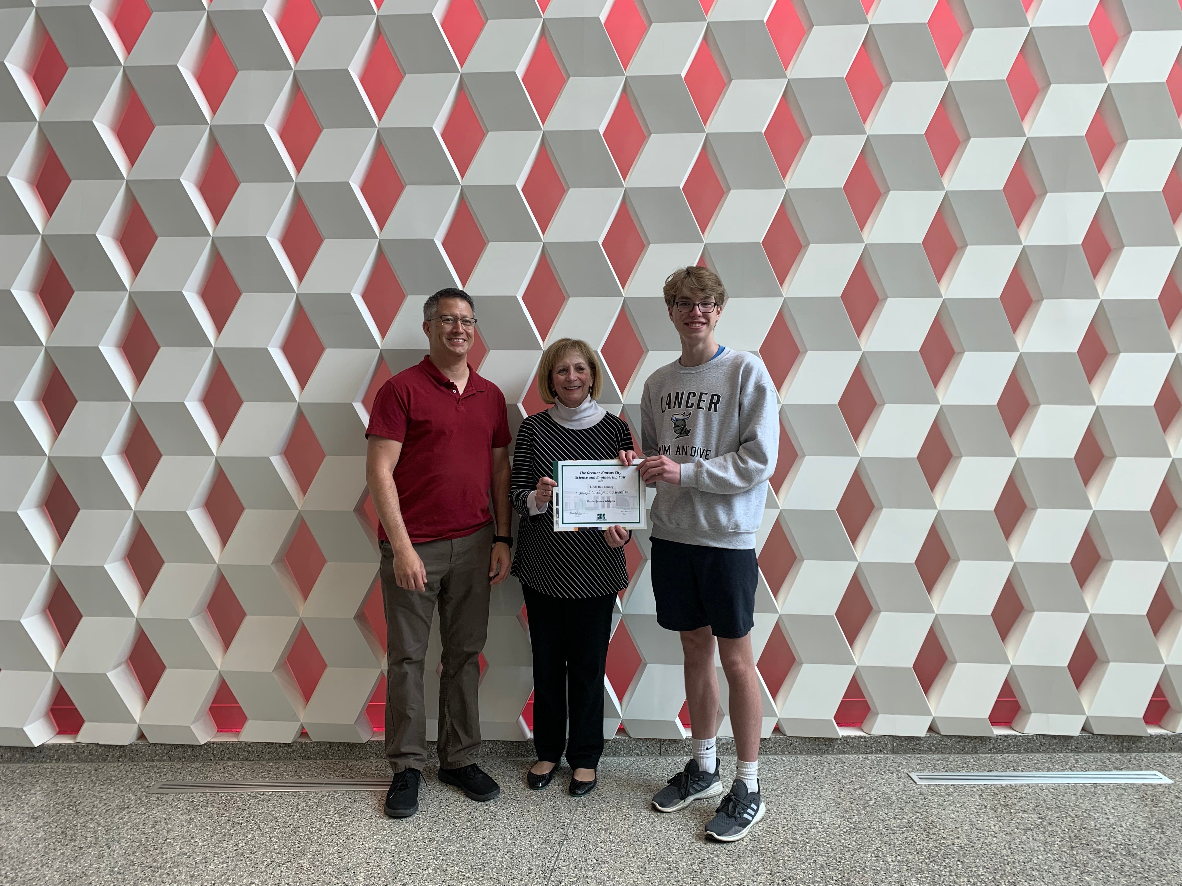 Dr. Kenneth Lee and Linda Hall Library President Lisa Browar with 2022 James C. Shipman award recipient James Schipfer.
