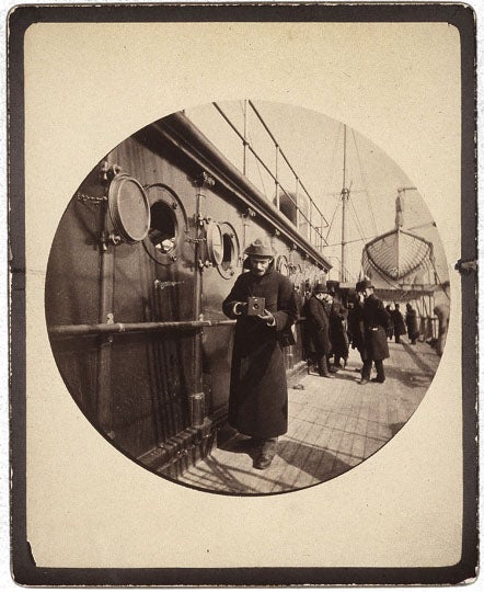 Portrait of George Eastman holding a Kodak camera, taken with another Kodak camera, 1890, on board a ship to France, George Eastman Museum, Rochester, N.Y. (eastman.org)