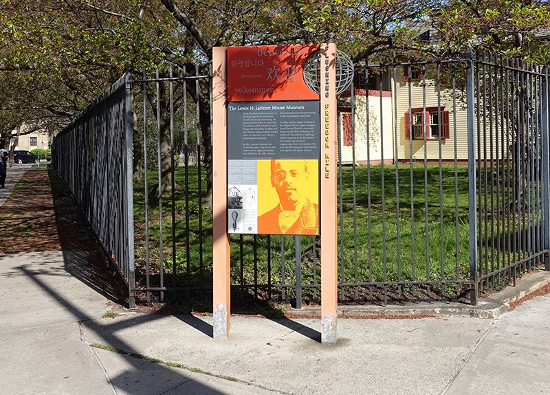 A Flushing Freedom Mile sign in front of the historic Lewis H. Latimer House at the south end of Leavitt Park, Flushing, Queens (Wikimedia commons)