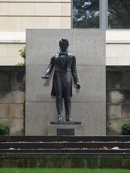 Statue of Charles Goodyear, holding a piece of vulcanized rubber, sculped in bronze by Walter Russell, 1939, Akron, Ohio (sculpturecenter.org)