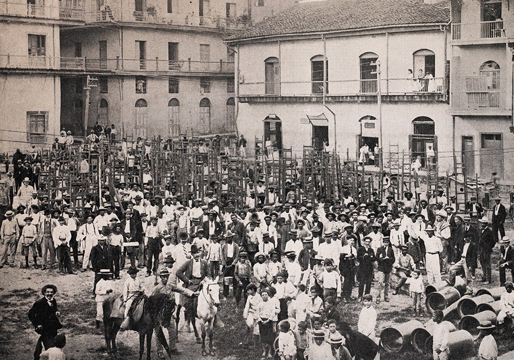 Fumigation brigade in Panama, 1905.
Fumigation gangs armed with ladders and buckets of wall paste cleaned up filth, emptied standing water, and fumigated houses by first pasting up cracks and crevices then burning pyrethrum powder to kill mosquitoes.
View in Digital Collection »
