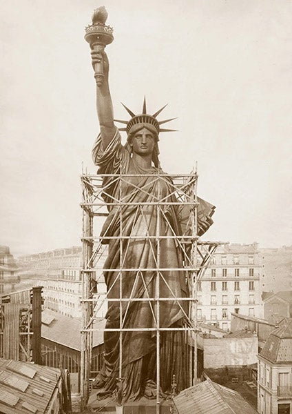 The Statue of Liberty pre-erected in Paris, 1884, photograph, New York Times, courtesy of Musée Bartholdi/ Christian Kempf (nytimes.com)